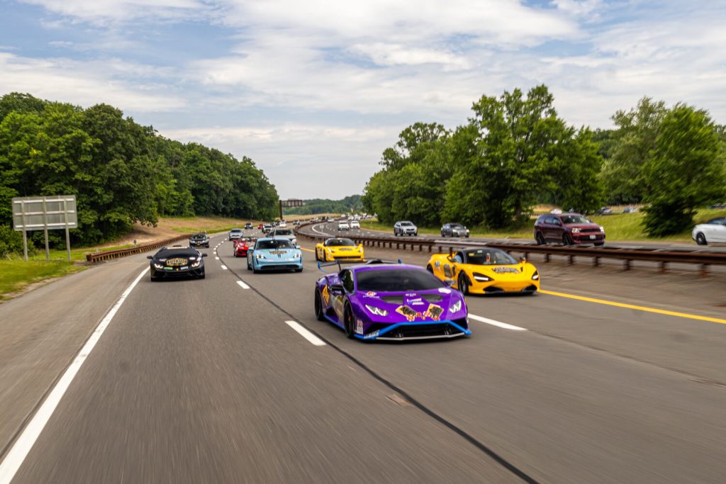 Five Star Exotic Cars convoy on the road